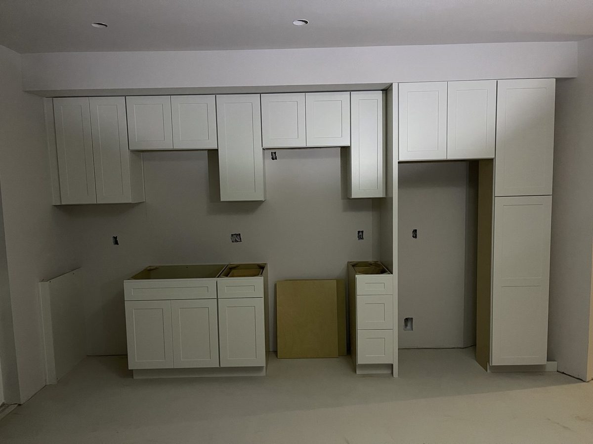 Kitchen cabinetry set and levelled, photographed before the countertops were templated