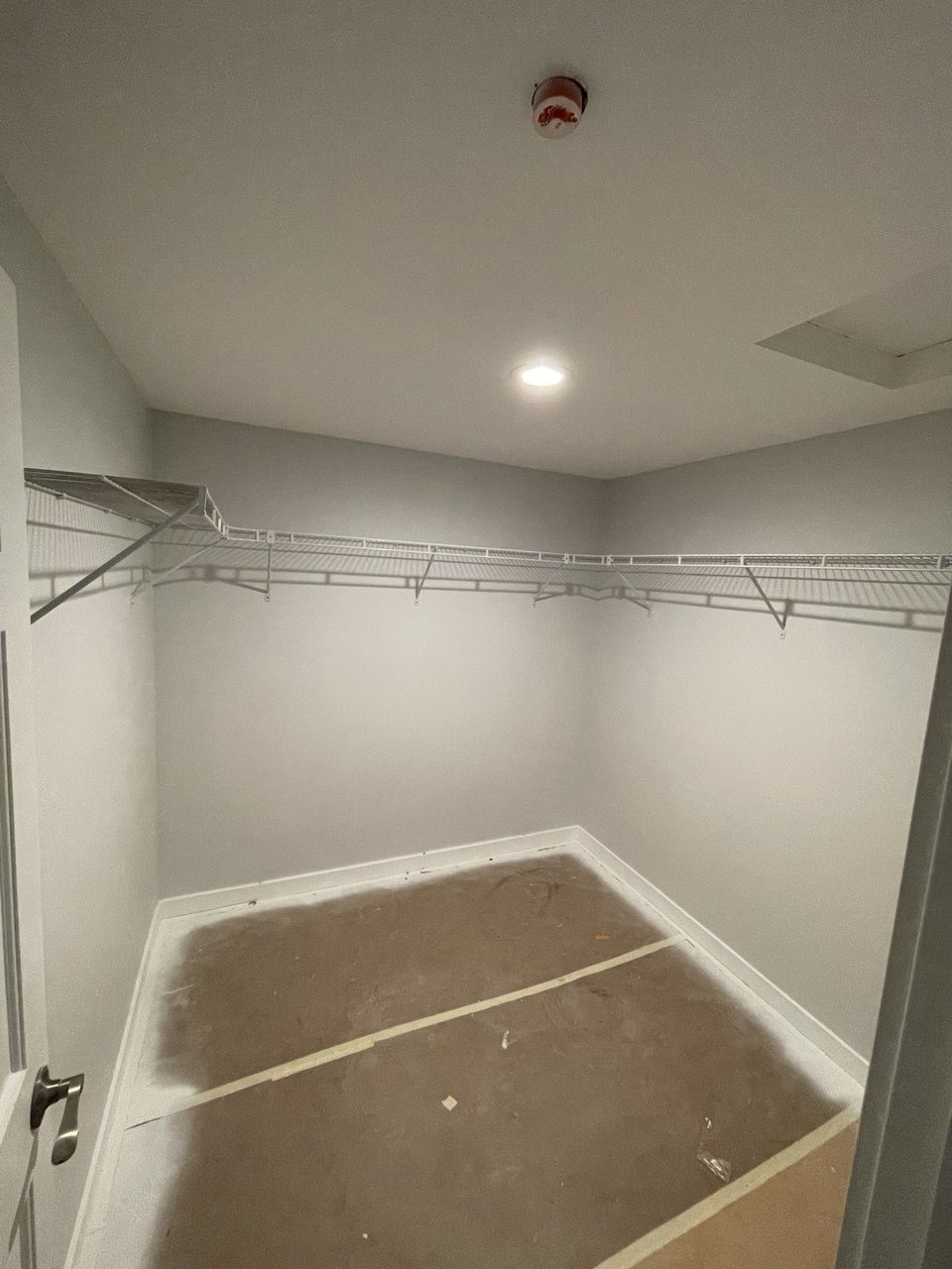 A shower pan prepared and ready for tile, with the enclosure framed